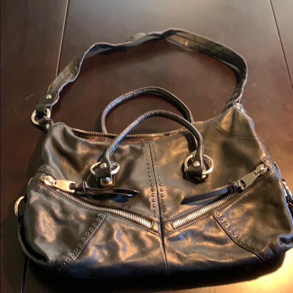Black leather purse with silver hardware.
